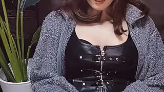 beautiful japanese ladyboy in cat ears strokes cock while crossdressing.