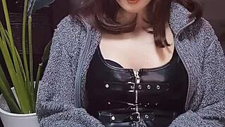 beautiful japanese ladyboy in cat ears strokes cock while crossdressing.