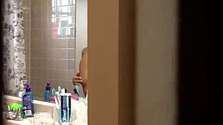busty latina gets peeked on in shower