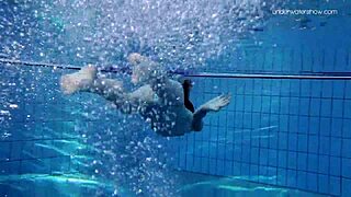 Skinny teen Anna Netrebko in bikini underwater.