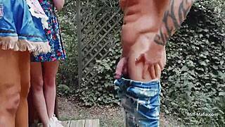 I watchs two bimbos gettin dirty outdoors wit a guy