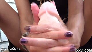 Sexy babe uses feet and hands on big dildo for jerking off