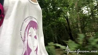 Two blonde lesbians flash each other in public outdoors.