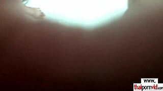 Thai girlfriend washes dishes in the kitchen