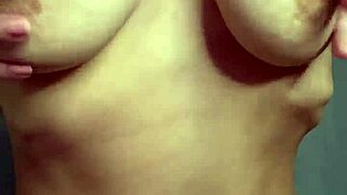 a hot student in homemade reality caresses her big natural tits softly