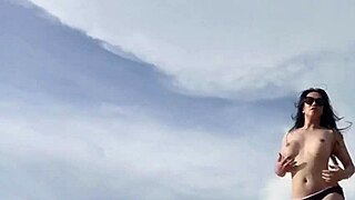 sexy hot ladyboy masturbates on white sand beach with big tits and monster cock