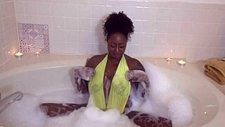 Giana soaks her pretty ebony pussy while masturbating solo.