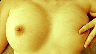 cutie massages her slippery tits and jerks off in homemade video