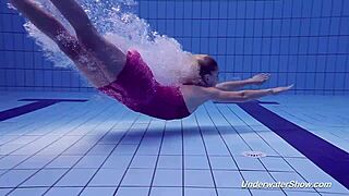 Proklova removes her bikini and dives underwater