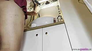 Hey, check out this cute redhead flashing her tight pussy in the bathroom