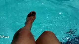 Feet splashing in the pool with lots of water