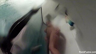 romi rain enjoys a steamy shower, touching her big tits and pussy