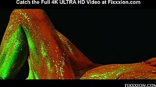 brunette goddess glows in the dark while masturbating with dildo