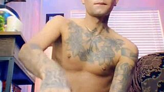 Adorable twink with tattoos spanks his tight ass before riding a big dildo