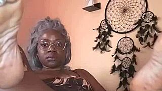 nae relaxes in bed, gently fingering herself with close up views of her ebony curves