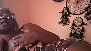 nae relaxes in bed, gently fingering herself with close up views of her ebony curves