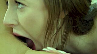 Busty Aiden licks Charly's pussy then strapon fucks.