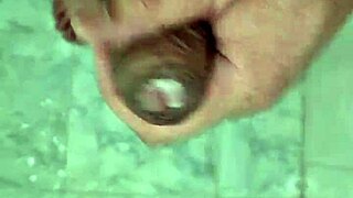 A young Brazilian twink enjoys a solo shower, his penis getting wet and babado