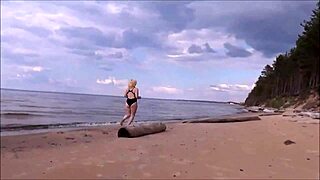 blonde woman bathing in the sea with a beautiful big ass in costume