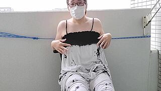 bold asian milf masturbates on balcony with big tits 😏