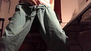 A guy strokes his gay partner's cock in this casual scene