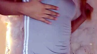 A transsexual in crossdressing touches herself richly.