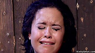 Tanned slut endures intense flogging while tied up in hardcore bondage.