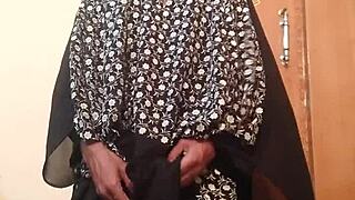 Hot gay action unfolds with a man in wife’s silk gown