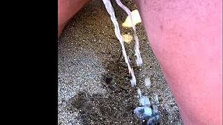 my wife taking a long pee on the beach today