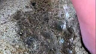 my wife taking a long pee on the beach today