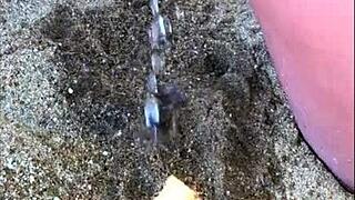 my wife taking a long pee on the beach today