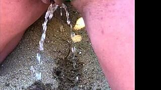 my wife taking a long pee on the beach today