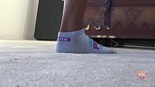 Ebony cougar shows puma socks and ass.