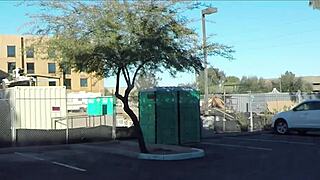 Porta gloryhole at construction site offers blowjobs and cum swallowing in outhouse