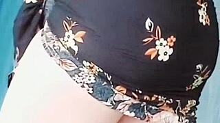 Pink Shirt Sissy Shemale Shows Big Butt in Skirt