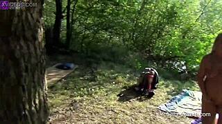 Public use of a cum and piss swallowing woman for everyone at the swimming lake part 1