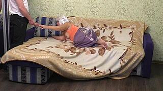 The mom tidied the sofa and relaxed with some personal enjoyment