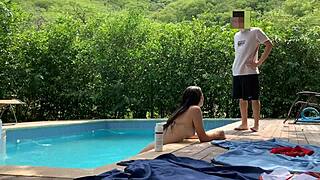 natasha and megan tan while guy cleans pool then swim naked