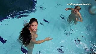 Iva Brizgina and Paulinka kiss passionately in pool