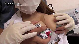 Beautiful Asian woman with great big natural breasts gets a blindfolded massage with oil with a dental massage