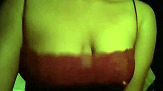 This teen 18+ is sucking on black tits in a red tank top, feeling so bisexual and excited.