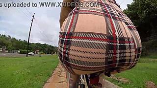 exhibitionist rides bike with butt plug, neighbor spies on tattooed ass.