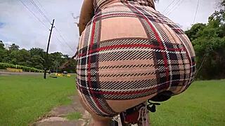 exhibitionist rides bike with butt plug, neighbor spies on tattooed ass.