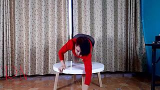 Brunette in pantyhose teases with striptease at round table