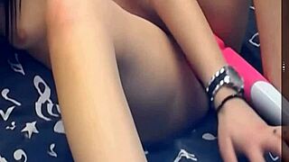 the girl is using two vibrating dildos on her pussy, it's so hot!