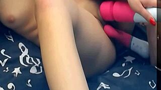 the girl is using two vibrating dildos on her pussy, it's so hot!