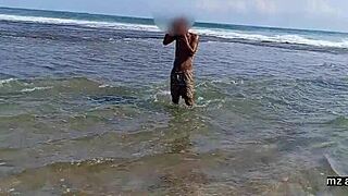 sex on the beach with african couple in wet dress