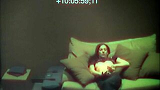 Sexy babe relaxes on sofa with hidden cam view