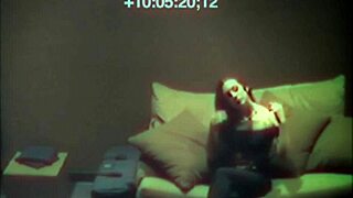 Sexy babe relaxes on sofa with hidden cam view