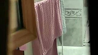 Donna leaves window open during shower, I secretly film her